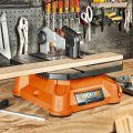 bladerunner sitting on table cutting wood piece