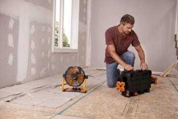 worx fan next to man opening up worx work table