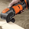 worx oscillating tool being held at angle cutting wood piece