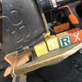 Worx drill with worx spelled out in color word cubes