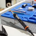 makerx wood and metal crafter resting on holder
