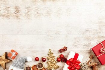 christmas decorations laying front down on wood table