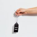 holding black friday tag