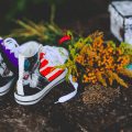 air brush painted shoes next to orange flowers