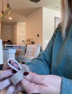 women holding loop of yarn