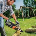 man using sharpened worx chainsaw