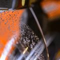 close up of rain droplets on car