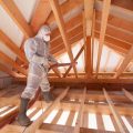 Worker With A Hose Is Spraying Ecowool Insulation In The Roof