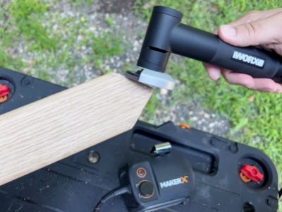 worx angle grinder sanding down point of wooden block