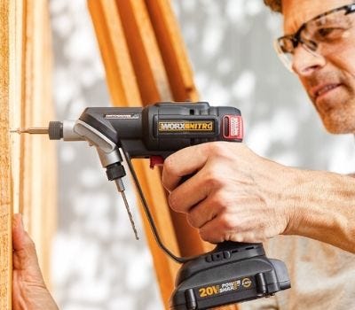 Worx Nitro Switchdriver 2.0 man using Worx Nitro Switchdriver 2.0 to drill a whole