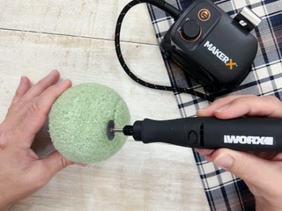 rotary tool cutting the top of the foam ball