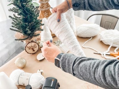 holding the yarn tree wrap the lights around tree