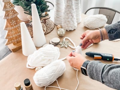 pressing yarn to point of foam tree top