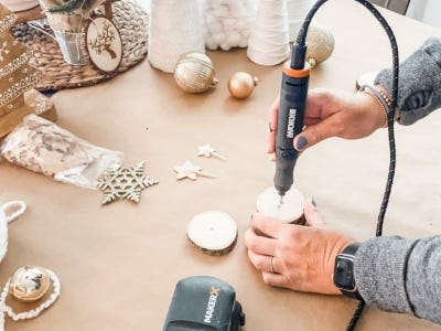 using drill rotary tool to drill whole into wood stand