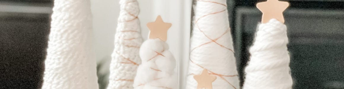 profile shot of five yarn wrapped trees