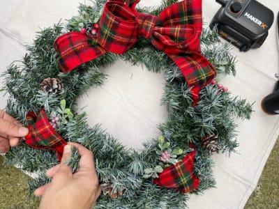 filling in extra sports on wreath with plaid bow