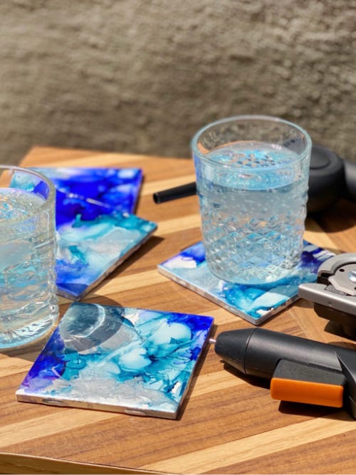 finished coasters on the table with drink glasses