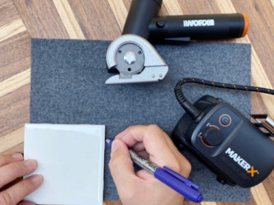 using pen to trace around coaster onto felt
