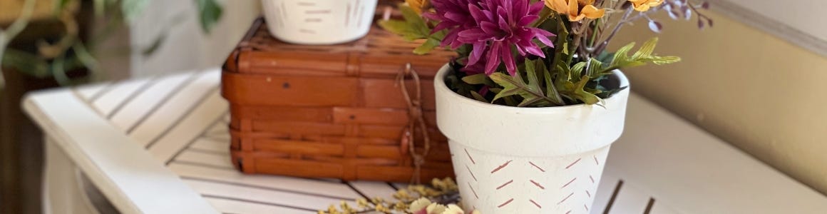 Hand etched pot with plant 