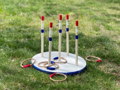 completed ring toss on the ground with rings around it