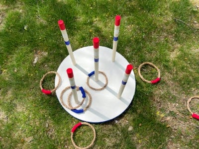 top down angle of the completed ring toss on the ground with rings around it