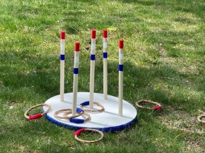 completed ring toss on the ground with rings around it