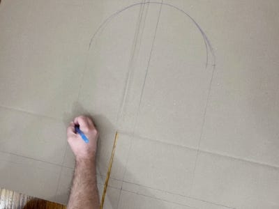 using pencil to draw on top of cardboard