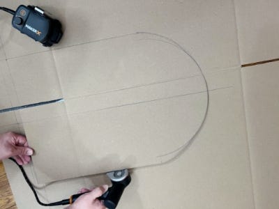 using zipsnip to cut out stencil from cardboard