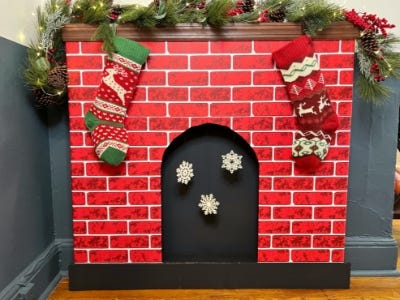 finished red and white brick fireplace with decorations