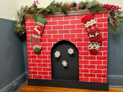 finished red and white brick fireplace with decorations and snowflakes