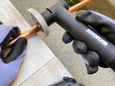 using the worx angle grinder to cut copper pipe