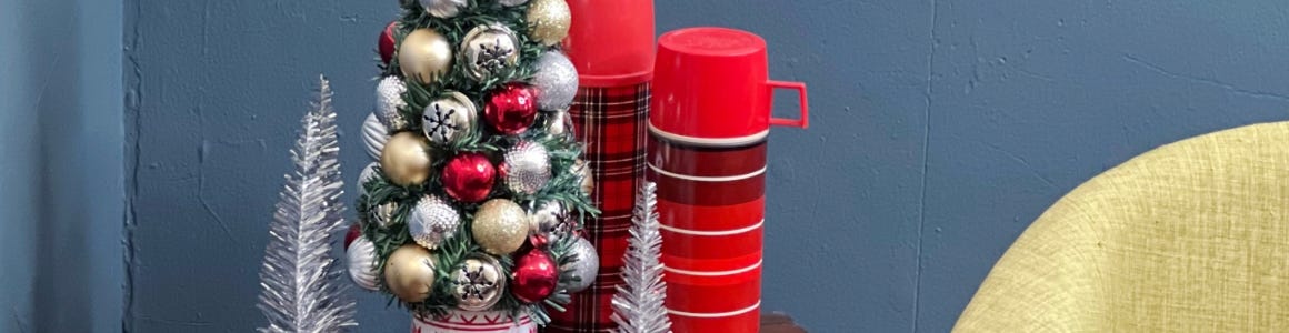 finished ornament tree on an end table with a star at the top