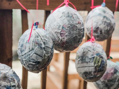 Five ballons hanging and drying next to each other