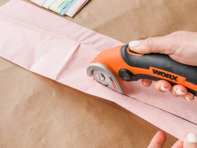 Pink color tissue being cut by orange zipsnip