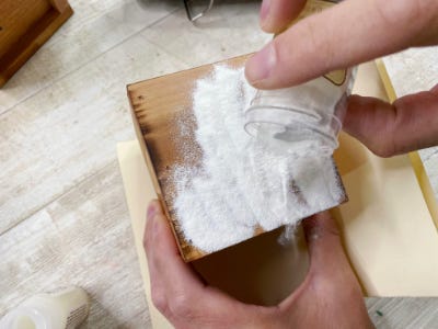 pouring embossing powder too wood piece