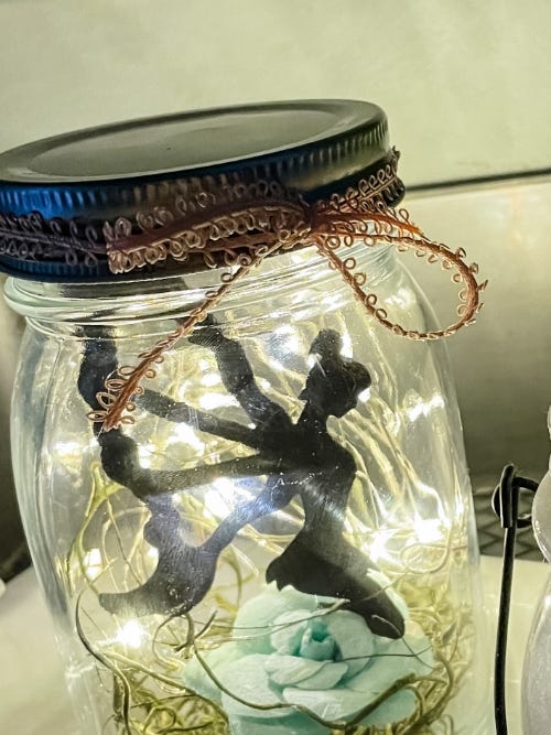 jar with fairy inside and lights