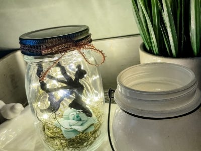 lighted mason jar with lights and fairy inside