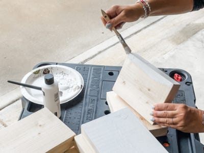 painting the sides of the wood block with silver acrylic paint