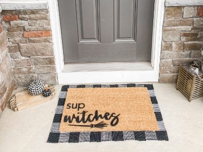 Decorative doormat in front of door