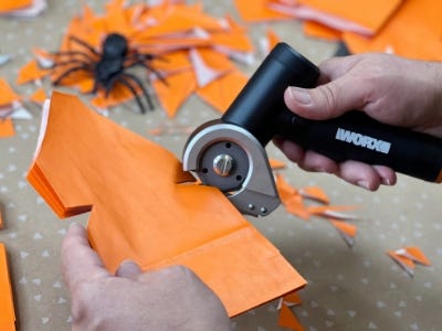 Zipsnip cutting along lines or orange paper tissue