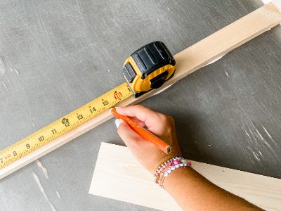using measuring tap to mark spots on glued wood peice