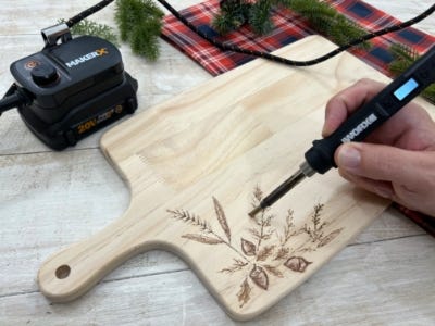 using wood burning gift to burn leafs into wood plate