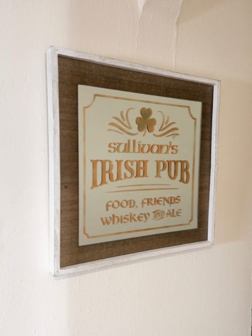 mirror with text that says Irish Pub on it