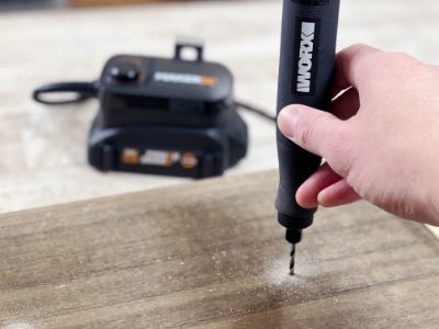 using rotary tool to drill hole into wood