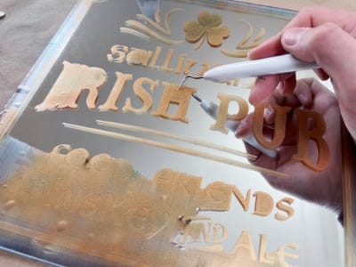 using stencil pick to remove stencil from glass