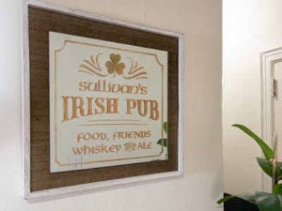 vintage irish pub sign hanging from wall