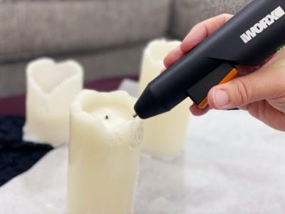 using glue gun to reform the top of melted candle