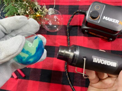 using heat gun to melt crayon inside clear ornament