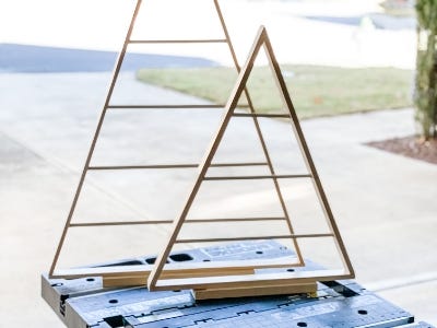 image of the complete wooden trees with the dowels in place on top of the work table