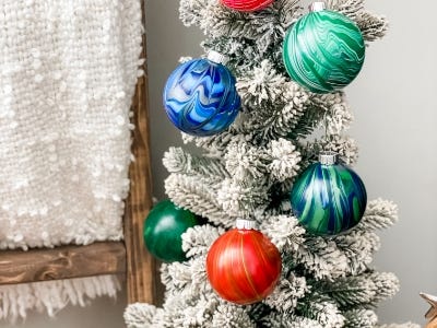 multi color ornaments hanging from Christmas tree